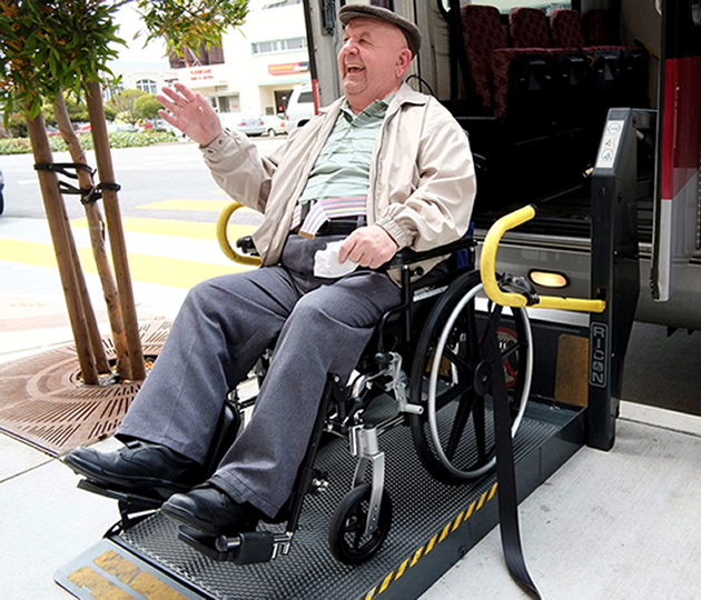 man in wheelchar using public transportation