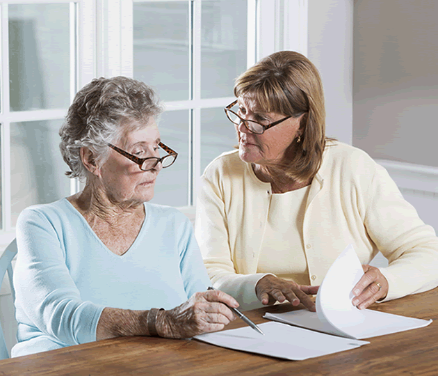 elderly woman reviewing paperwork